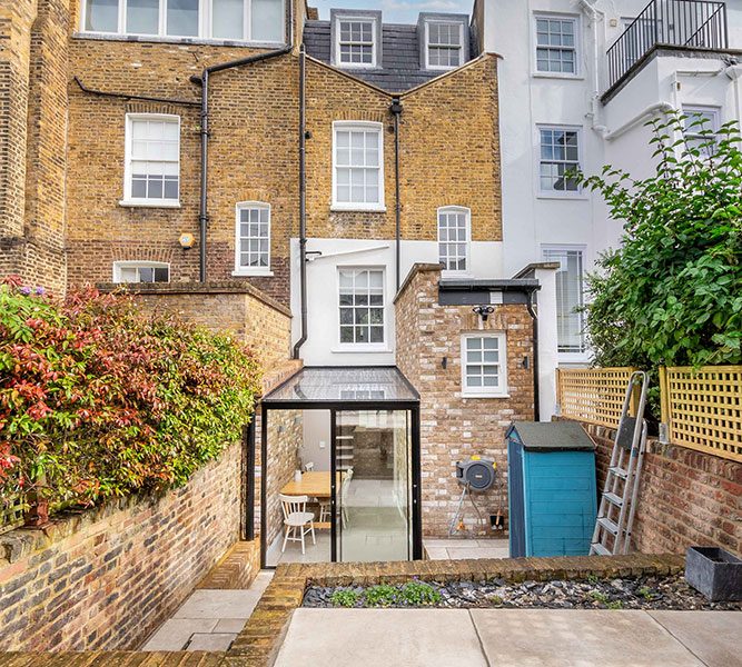 Listed Building Grade II glass structures storey extension and new build brickwall along with internal reconfiguration and landscaping.